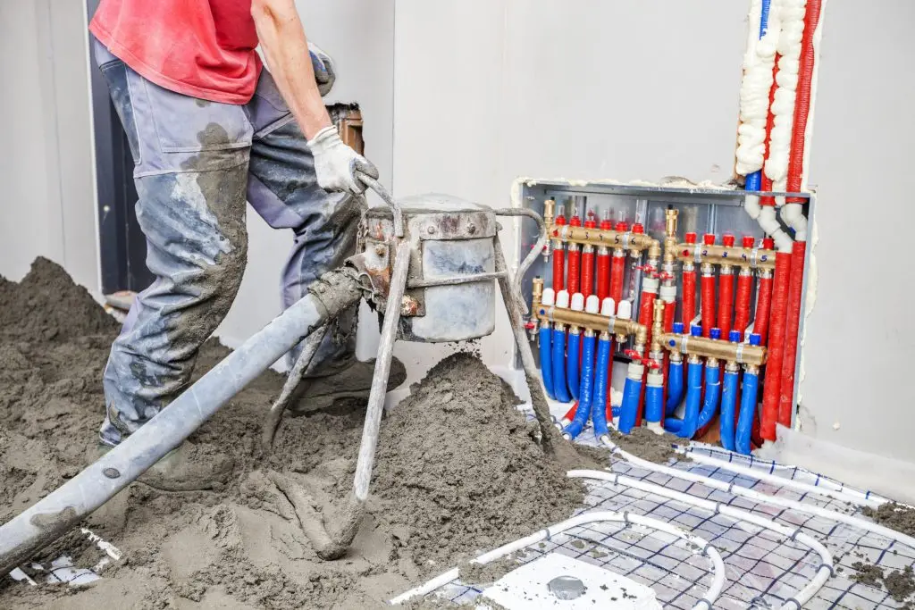 a worker installing an underfloor heating