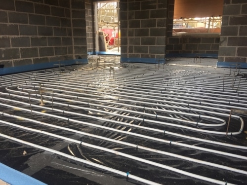 An underfloor heating system under construction